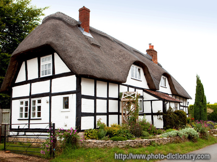 traditional thatched cottage - photo/picture definition - traditional thatched cottage word and phrase image