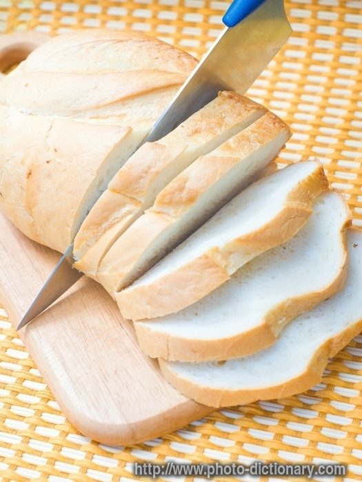 bread cutting - photo/picture definition - bread cutting word and phrase image