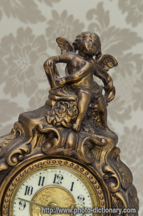 antique French clock - photo/picture definition - antique French clock word and phrase image
