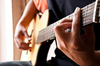 playing guitar - photo/picture definition - playing guitar word and phrase image