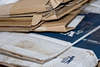 folded cardboard boxes - photo/picture definition - folded cardboard boxes word and phrase image